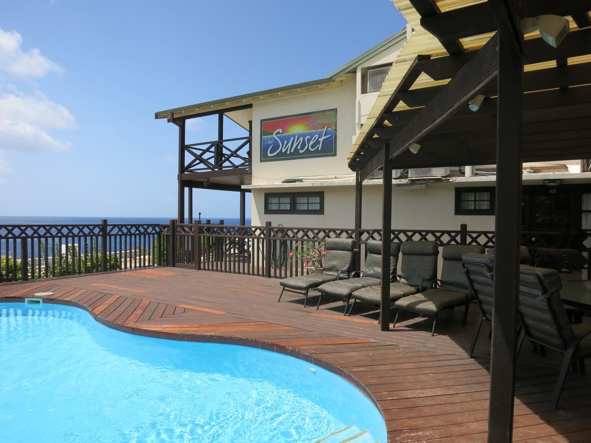 Hotel The Sunset Flying Fish Cove Exterior foto